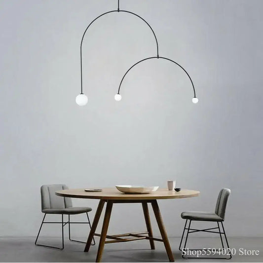 Modern black iron line chandelier with three white glass bulbs for living room featuring decorbites iron line design