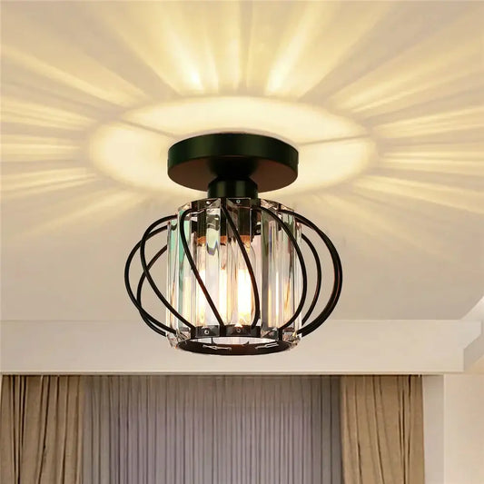 Modern black iron round crystal ceiling chandelier with clear crystal prisms and warm glowing bulbs for dining room decorbites iron round