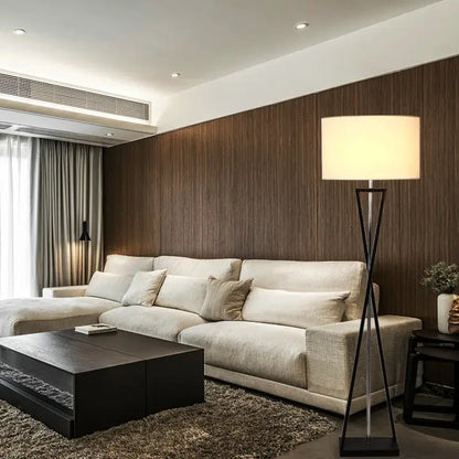 Modern black iron table lamp with fabric shade featuring a sleek tripod base ideal for bedroom decorbites iron table