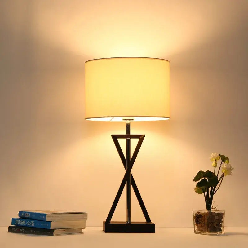 Modern black iron table lamp with cylindrical cream fabric shade for bedroom by decorbites iron table lamp decorbites iron