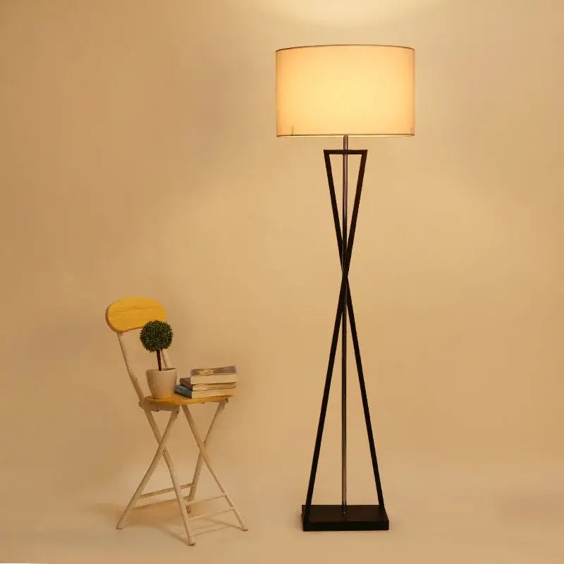 Modern black iron table lamp with cylindrical off-white fabric shade for bedroom by decorbites iron table decor