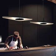 Modern black irregular art pendant lamp with sleek disc-shaped design and warm glow for living room decorbites pendant lamp