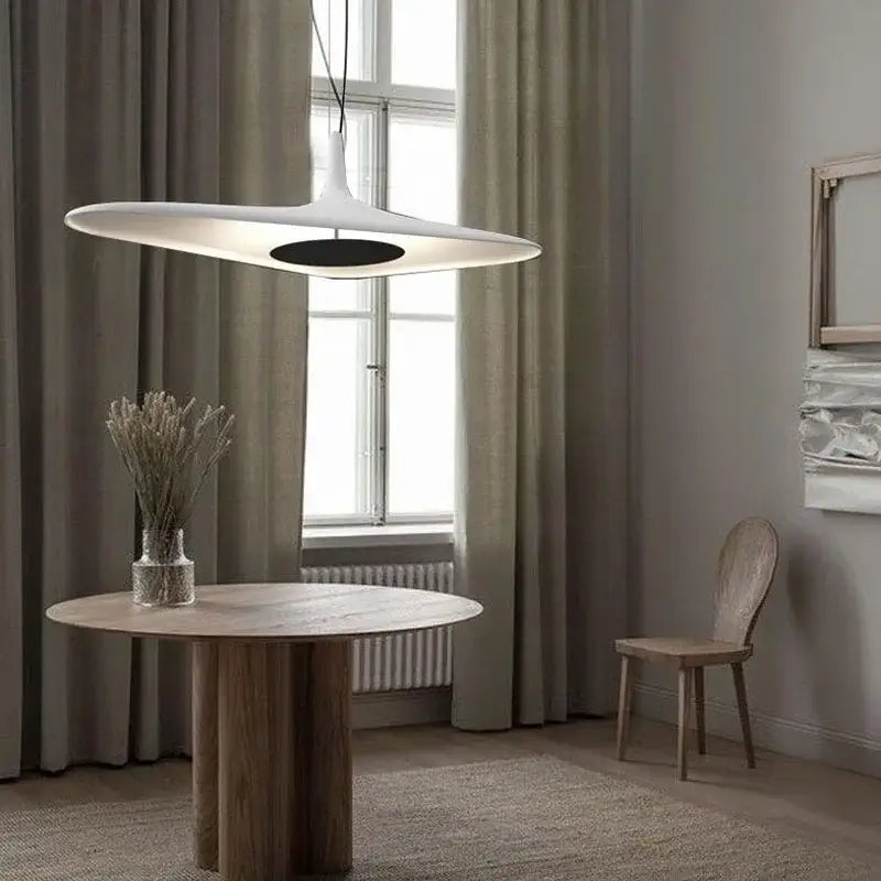 Modern white disc-shaped pendant lamp with black center featuring decorbites irregular art design for living room decor