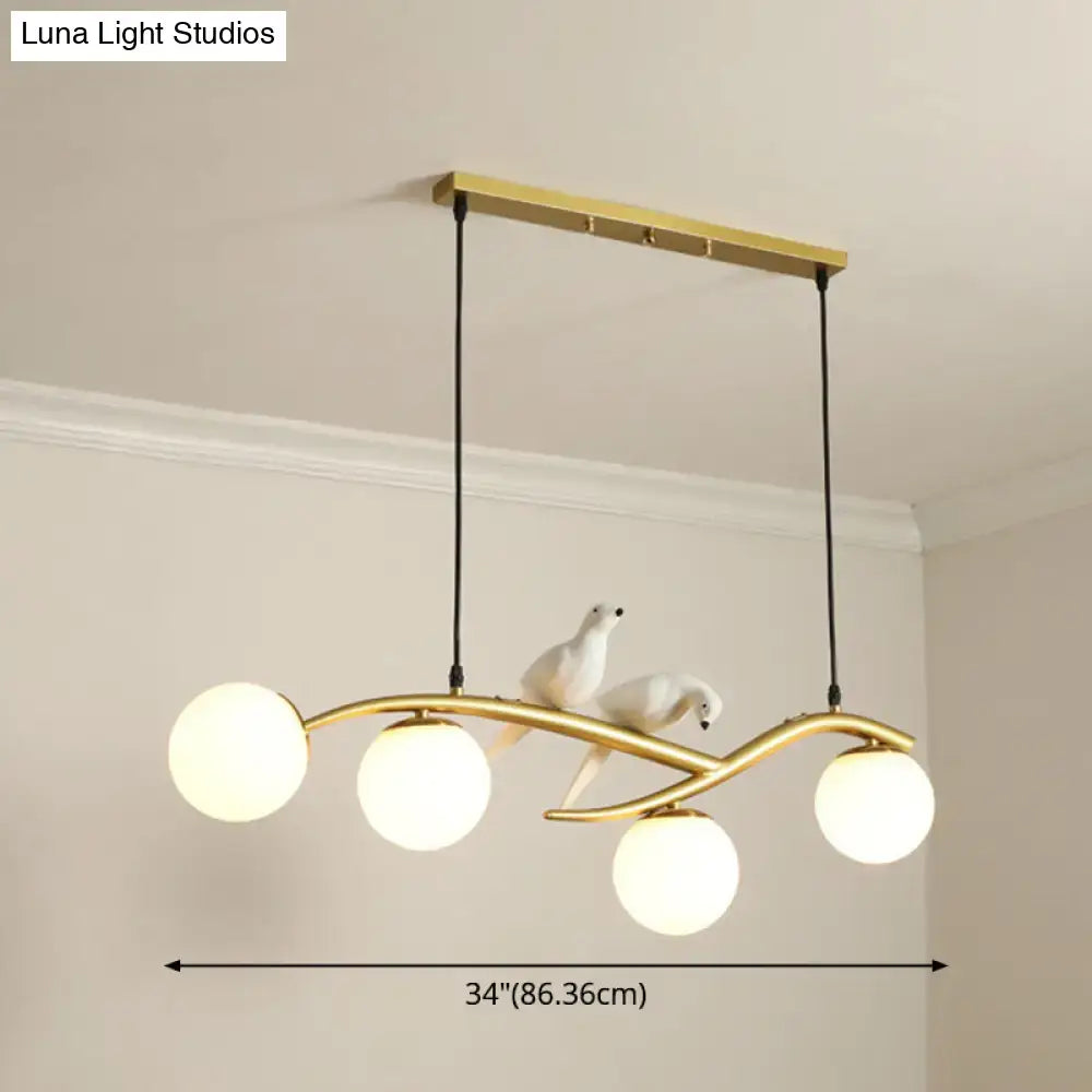 Decorbites™ modern island pendant light with gold-tone frame, frosted glass bulbs, and white dove sculptures for dining room