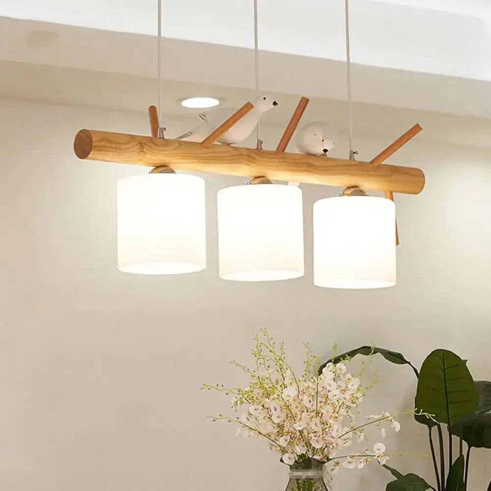 DecorBites modern island pendant light with wooden branch arms frosted glass shades and bird figurines for dining room