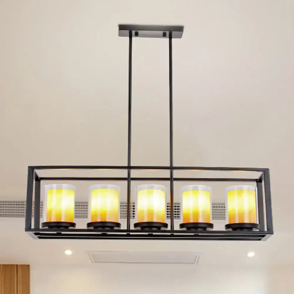 Black metal island pendant with five warm yellow glass candle-style bulbs and white glass accents for kitchen lighting