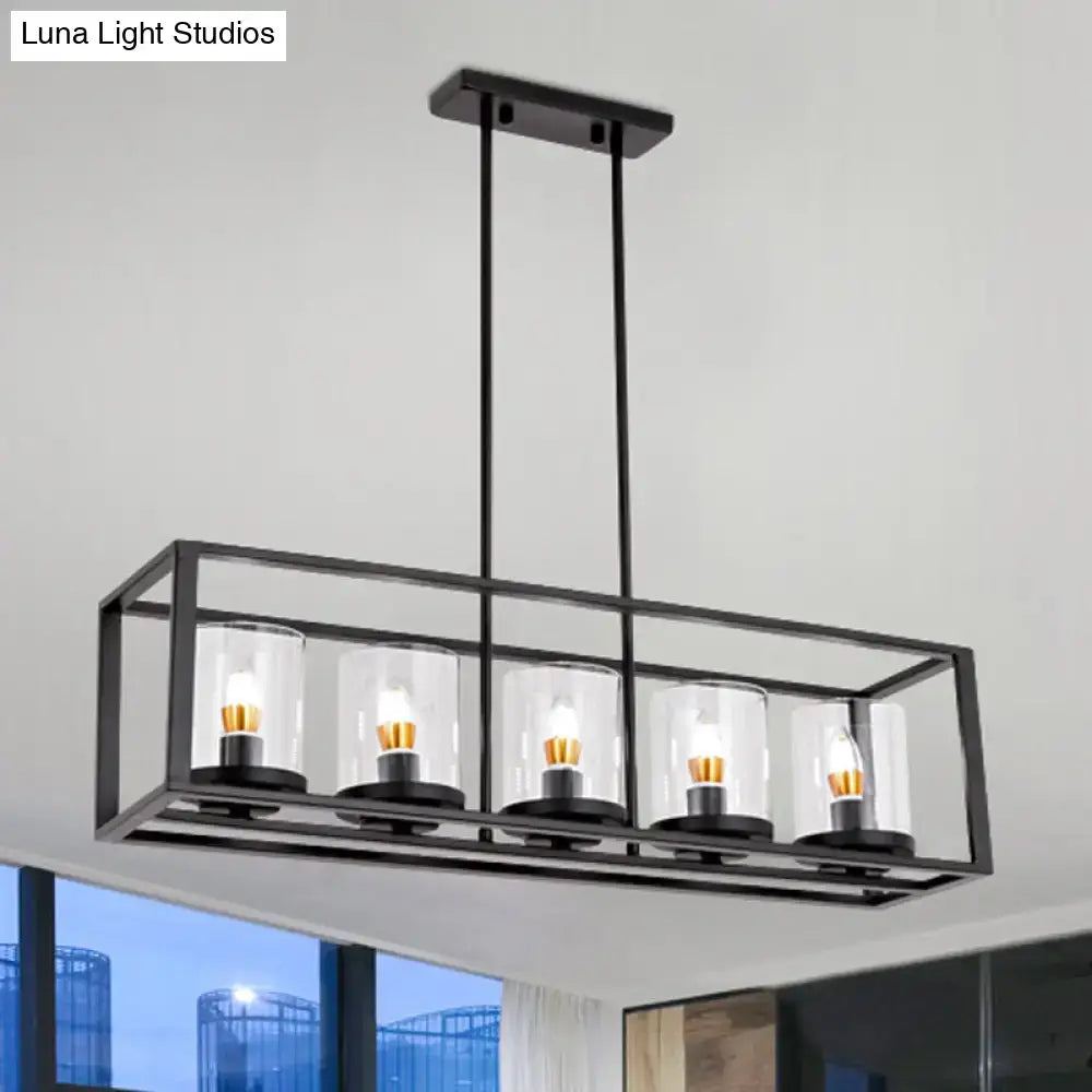 Black metal rectangular island pendant with five white glass cylinders housing warm led incandescent bulbs for kitchen lighting