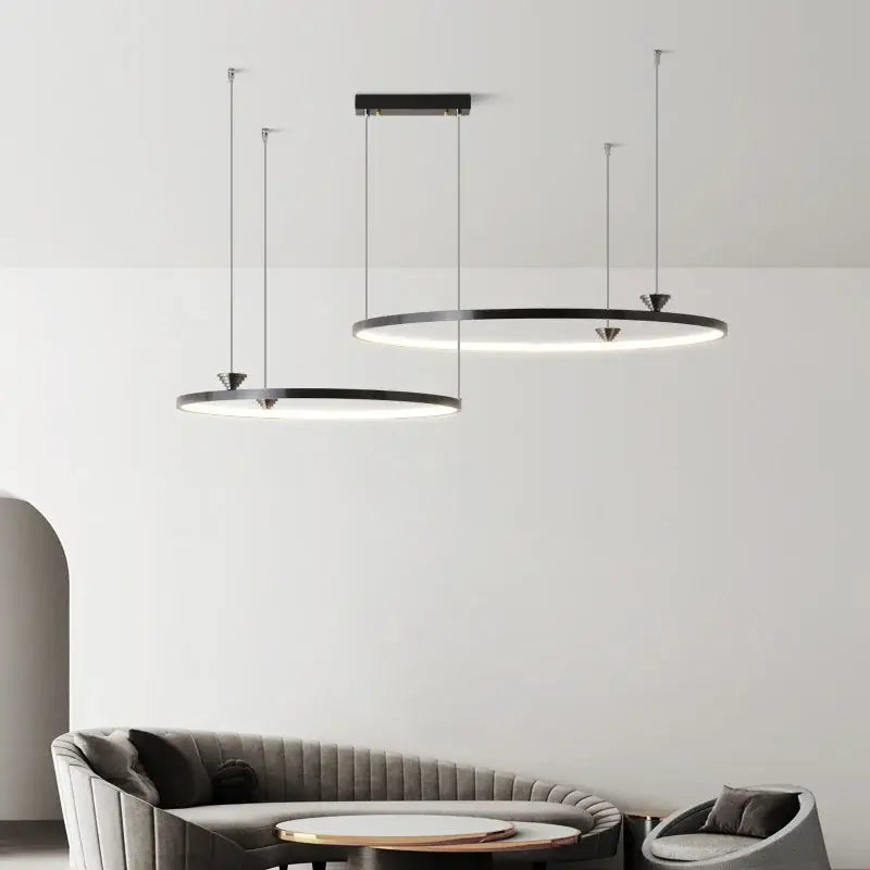 Modern black italian style led pendant light with sleek metallic chains and minimalist circular design for living room