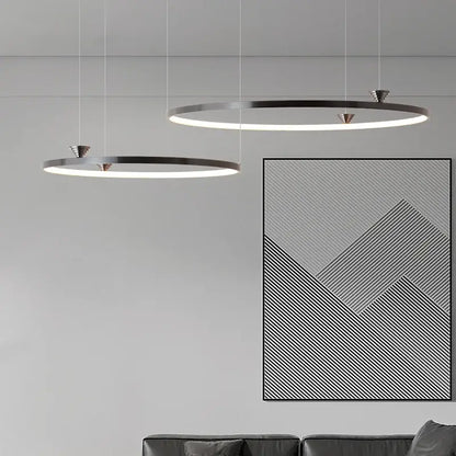 Modern black italian style led pendant light with circular illuminated rings and sleek metallic frames for living room