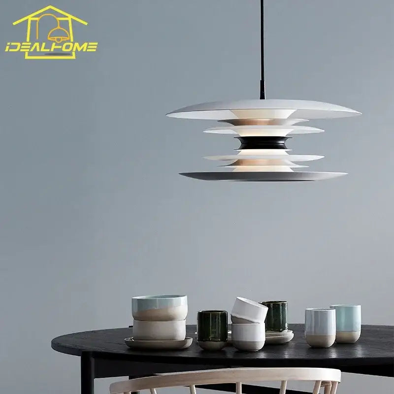 Modern black layered iron art flying pendant light with white tiered design and black central accent for dining room decorbites iron art