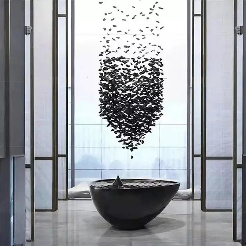 Modern black leaf crystal led chandelier featuring a black glossy ceramic bowl with central spike and concentric ridges decorbites crystal led
