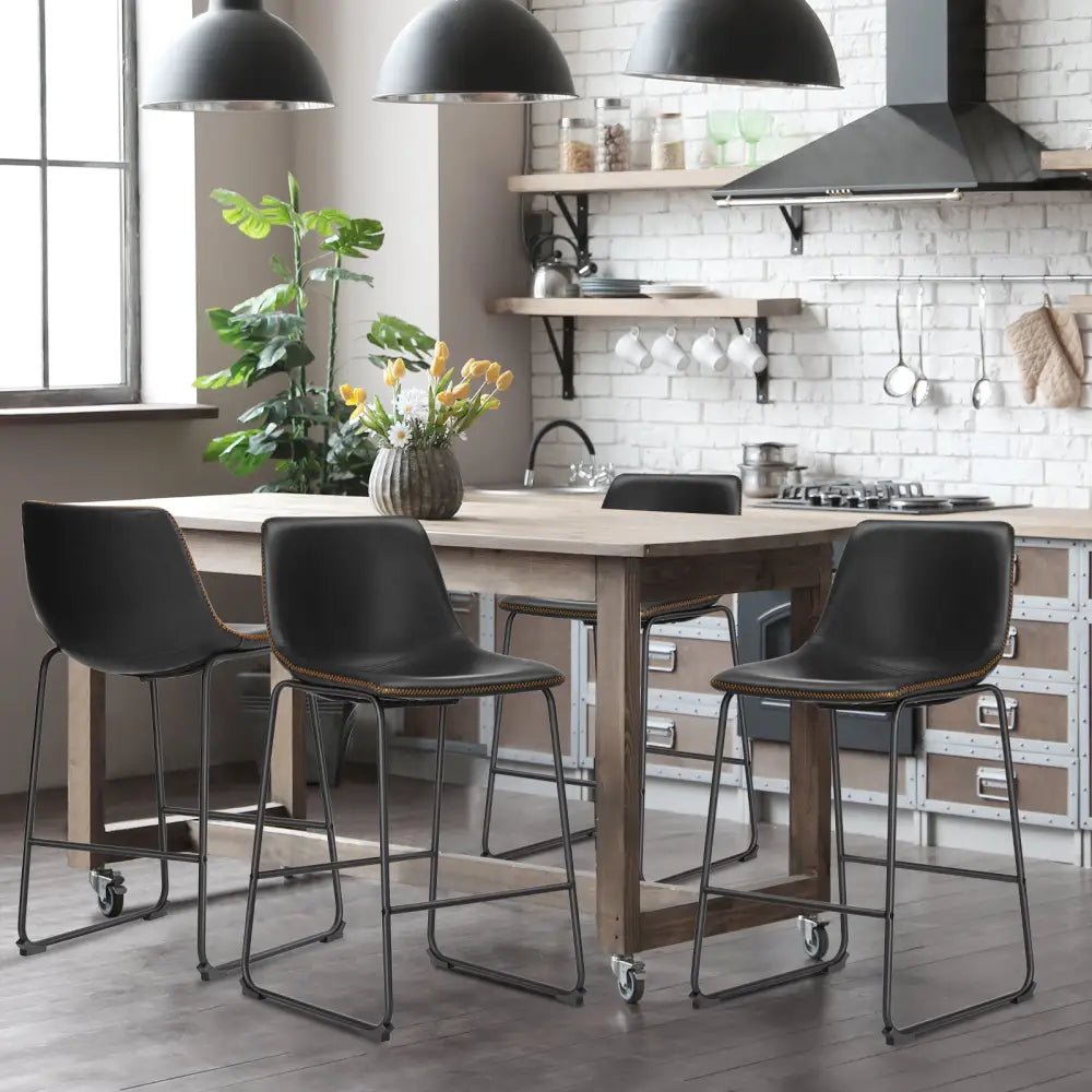 Modern black leather bar stools with gold stitching for kitchen island - Decorbites