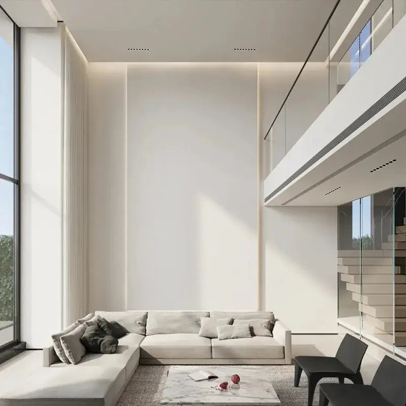 A modern black led grille downlight recessed spot light shown above a sleek off-white sectional sofa with plush cushions