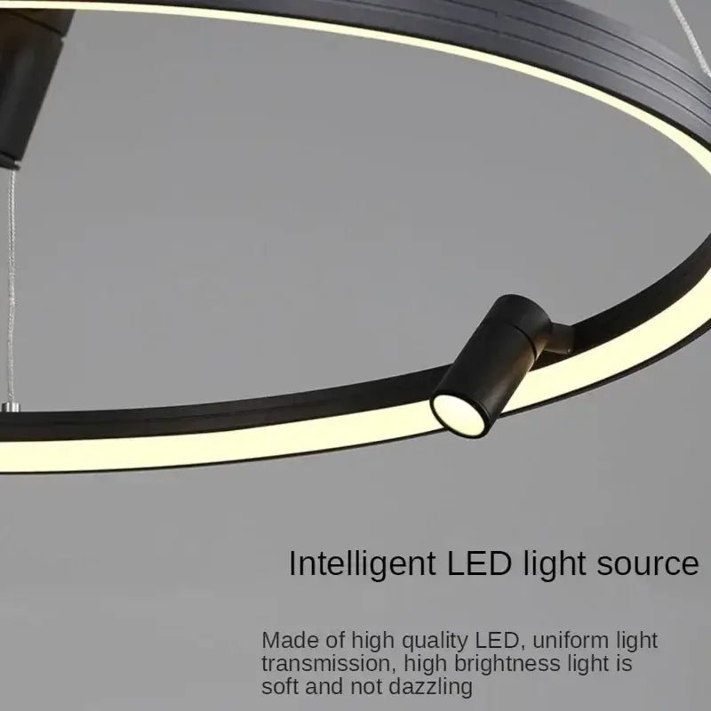 Modern black led ring chandelier pendant light with sleek circular design and integrated spotlight for kitchen use