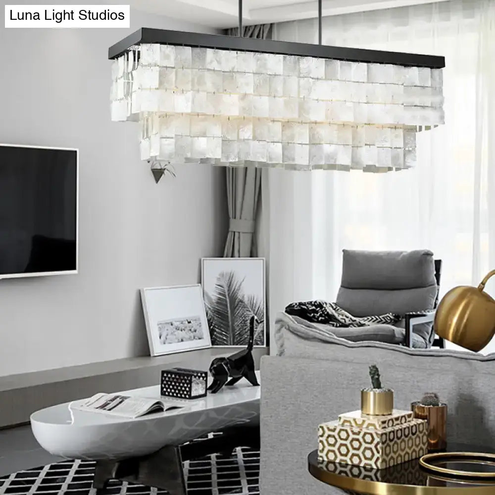 Decorbites modern rectangular island light fixture with layered translucent white glass panels and black metal frame