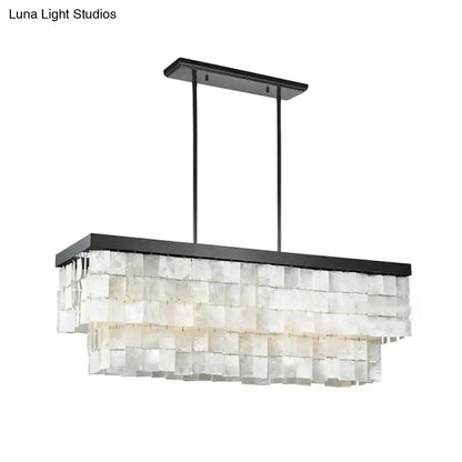 Black metal rectangular island light fixture with layered translucent white shell panels for living room decor