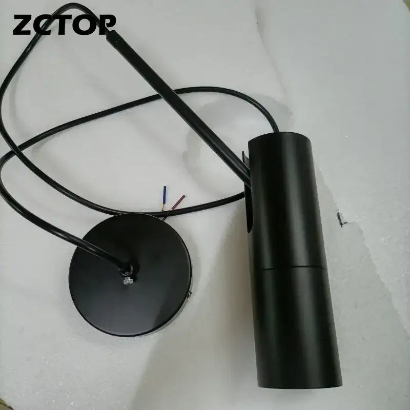 Modern black led spotlight chandelier with matte cylindrical pendant light and attached wiring for living room use
