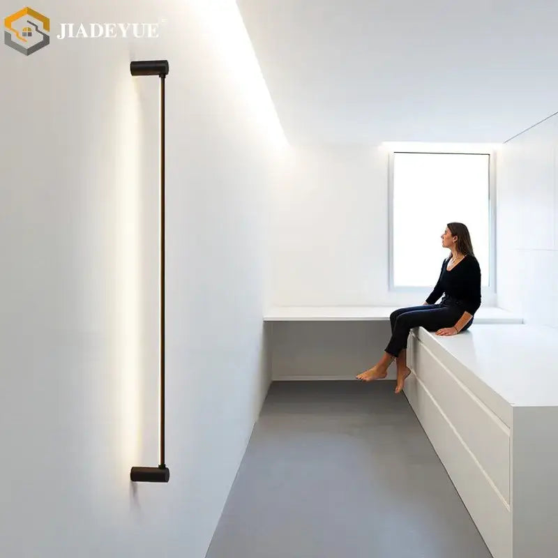 Modern black led strip wall lamp with sleek cylindrical design and matte finish for minimalist living room decorbites led strip