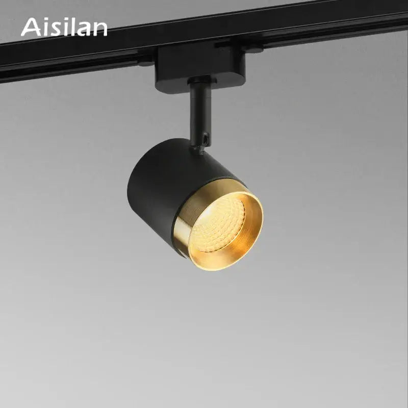 Modern black led track spotlight with black and gold cylindrical design for kitchen rail ceiling lighting