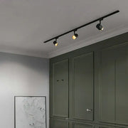 Modern black led track spotlight with three adjustable spotlights on sleek rail for kitchen ceiling lighting