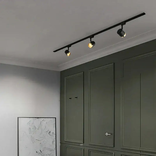 Modern black led track spotlight with three adjustable spotlights on sleek rail for kitchen ceiling lighting