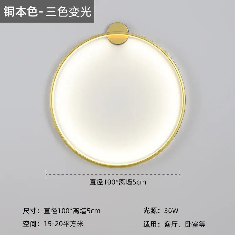 Modern black led wall circle light with gold-toned metallic frame and softly glowing white illumination for living room