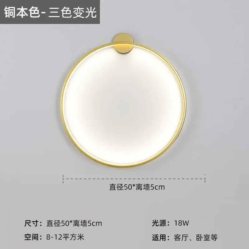 Modern black led wall circle light with gold-toned metallic frame and softly glowing white illumination for living room