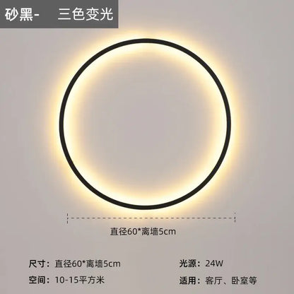 A sleek black modern led wall circle light with a glowing three-color-changing ring for living room use