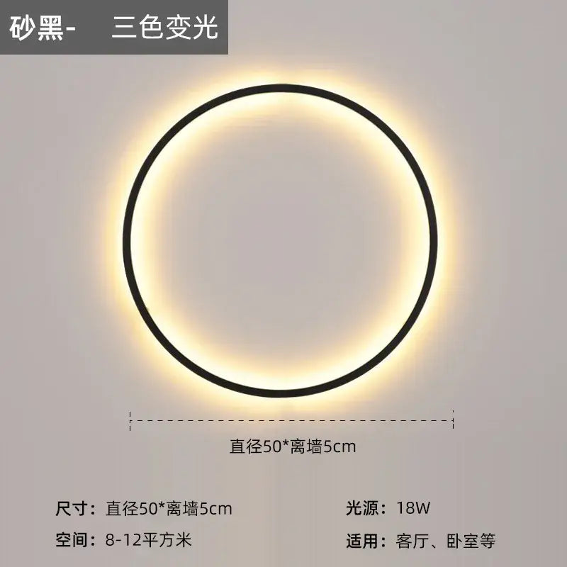 A sleek black modern led wall circle light with a glowing three-color-changing ring for living room use