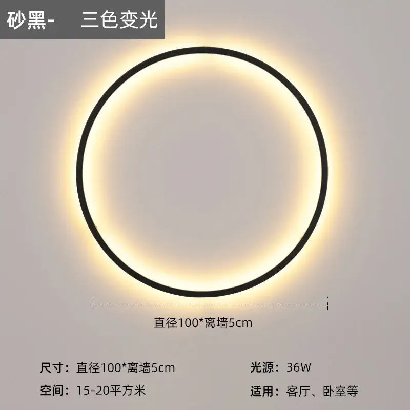 A sleek black modern led wall circle light with a glowing three-color-changing led ring for living room use