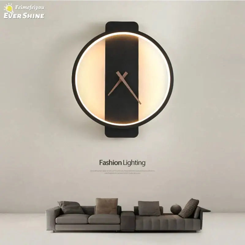 Modern black led wall clock lamp with illuminated circular face and minimalist design for living room use