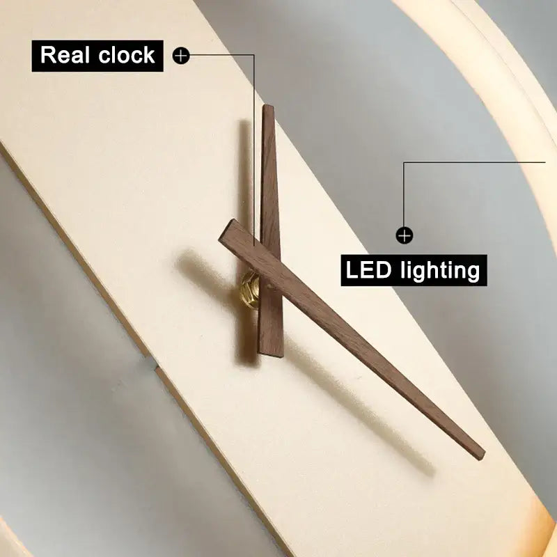 Modern black led wall clock lamp with slender wooden hands and warm led light ring for minimalist living room décor