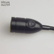 Modern black led wall lamp with adjustable gooseneck and power switch on handheld endoscope handle
