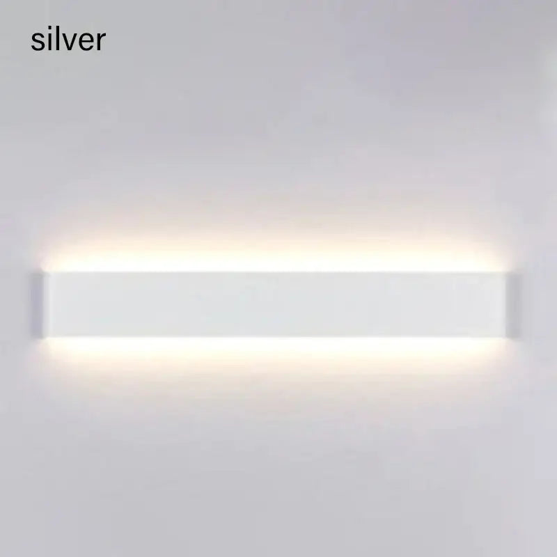 Silver rectangular decorbites led wall lamp with sleek modern design and touch sensor for bedroom lighting