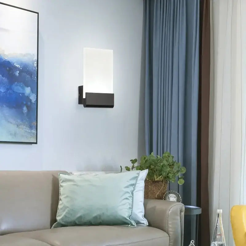 Modern black led wall lamp with frosted glass diffuser designed as a rectangular wall lamp for living room use