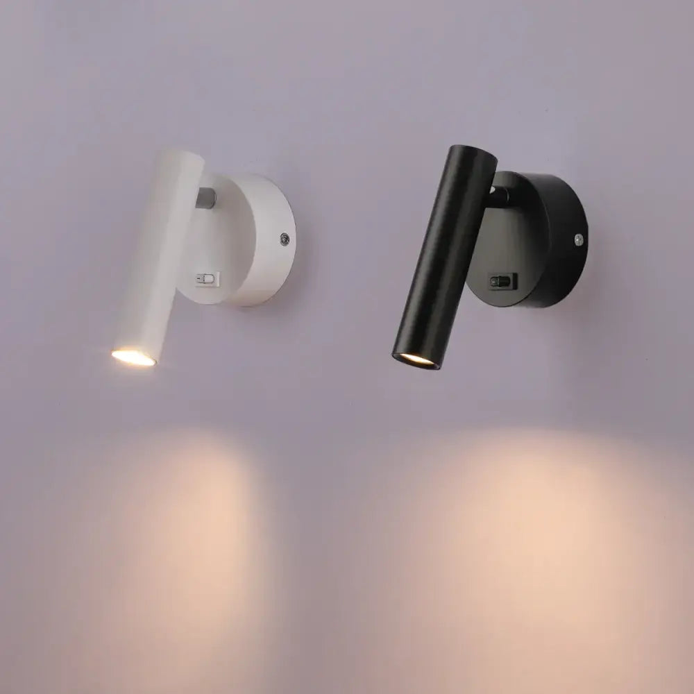 Modern black led wall lamps featuring adjustable cylindrical light fixtures in sleek white and matte black finishes