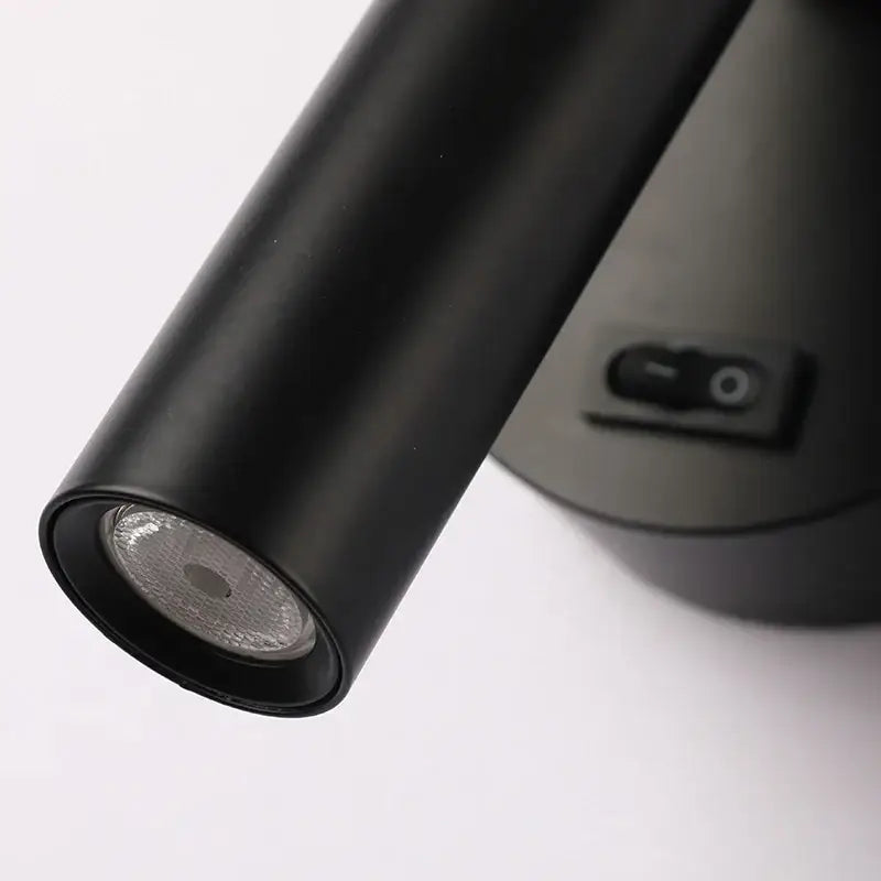 Modern black led wall lamps featuring an adjustable cylindrical spotlight with matte finish and visible reflector for reading