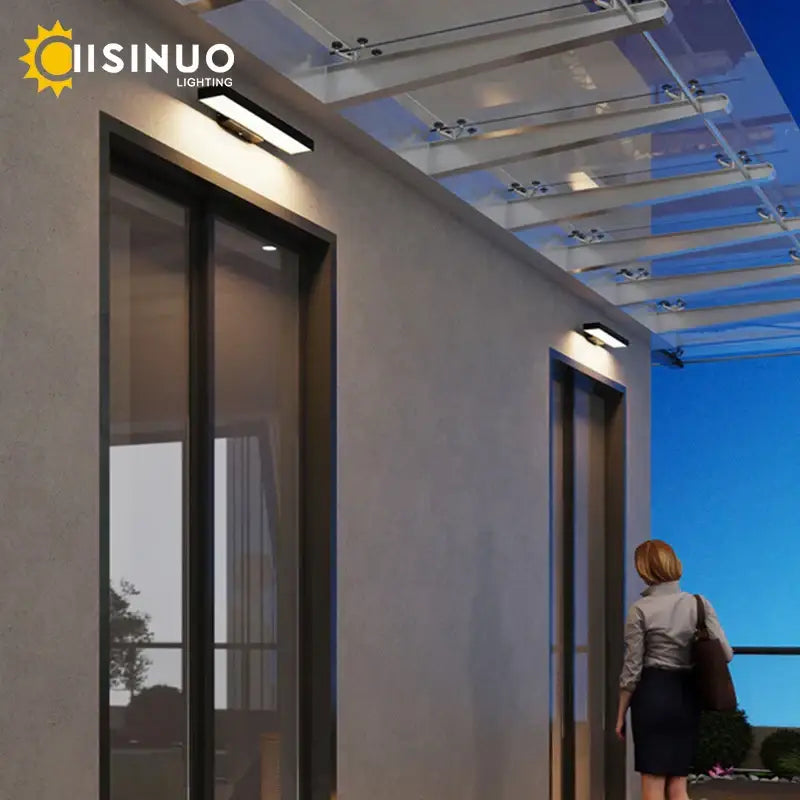 Modern black led wall light with dusk dawn motion sensor and integrated solar panel by cisino lighting