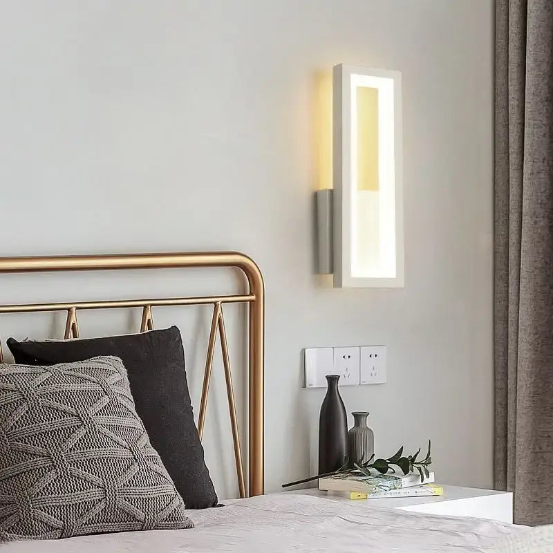 Modern black led wall sconce with sleek white frame and warm yellow backlighting ideal for bedroom decorbites led wall lighting