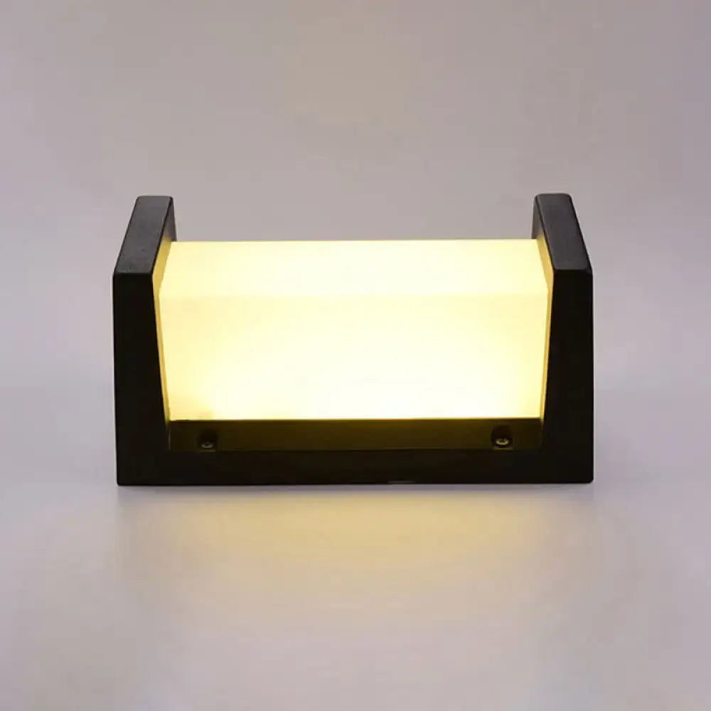Modern black led wall sconce outdoor light with warm glowing panel and maximum bulb wattage of 10w
