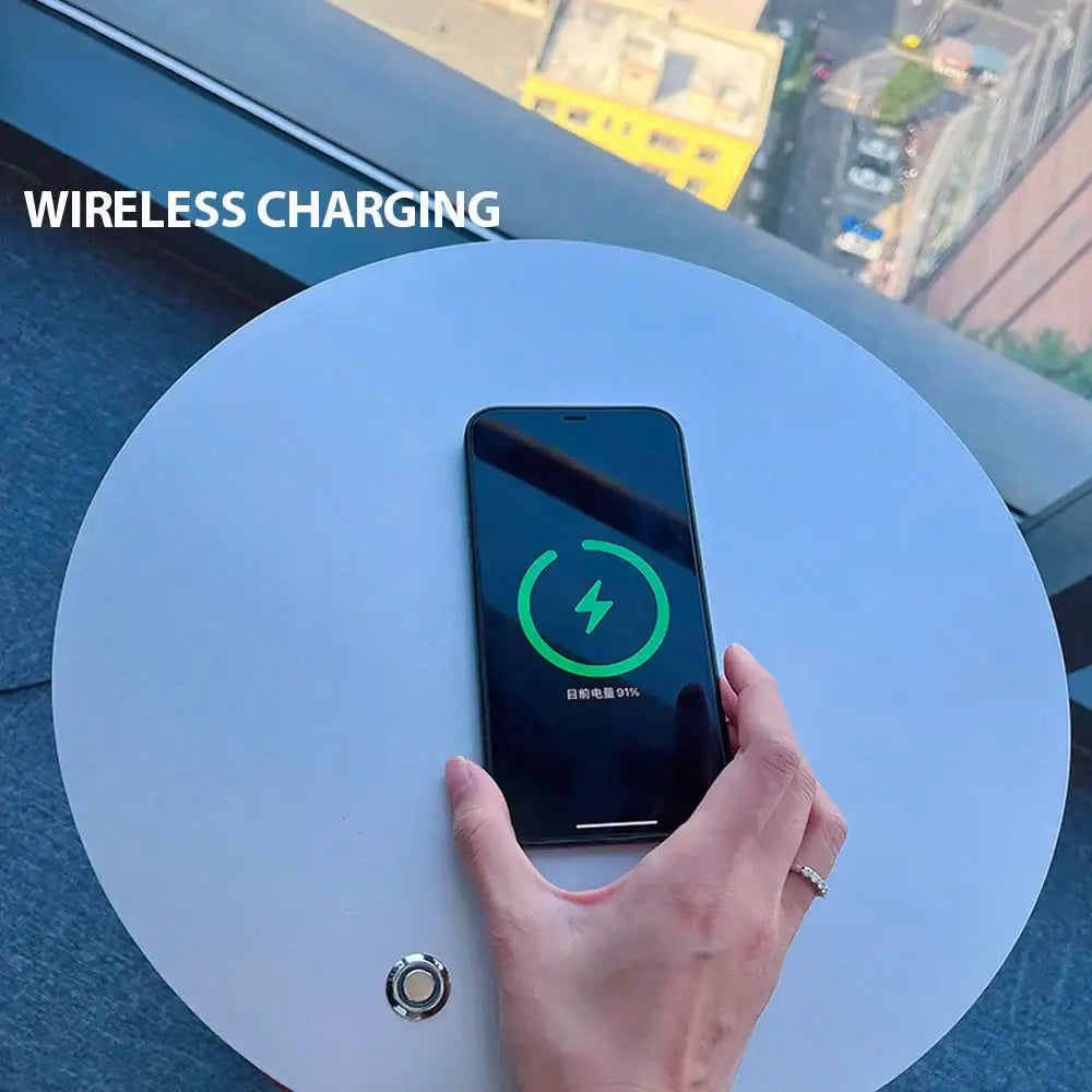 Modern black led wood shelf floor lamp with a black smartphone showing a green wireless charging icon on screen