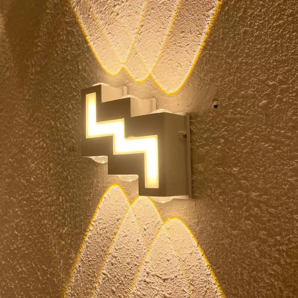 Modern black geometric wall lamp with ip65 led soft yellow lighting for outdoor decorbites ip65 led wall sconce