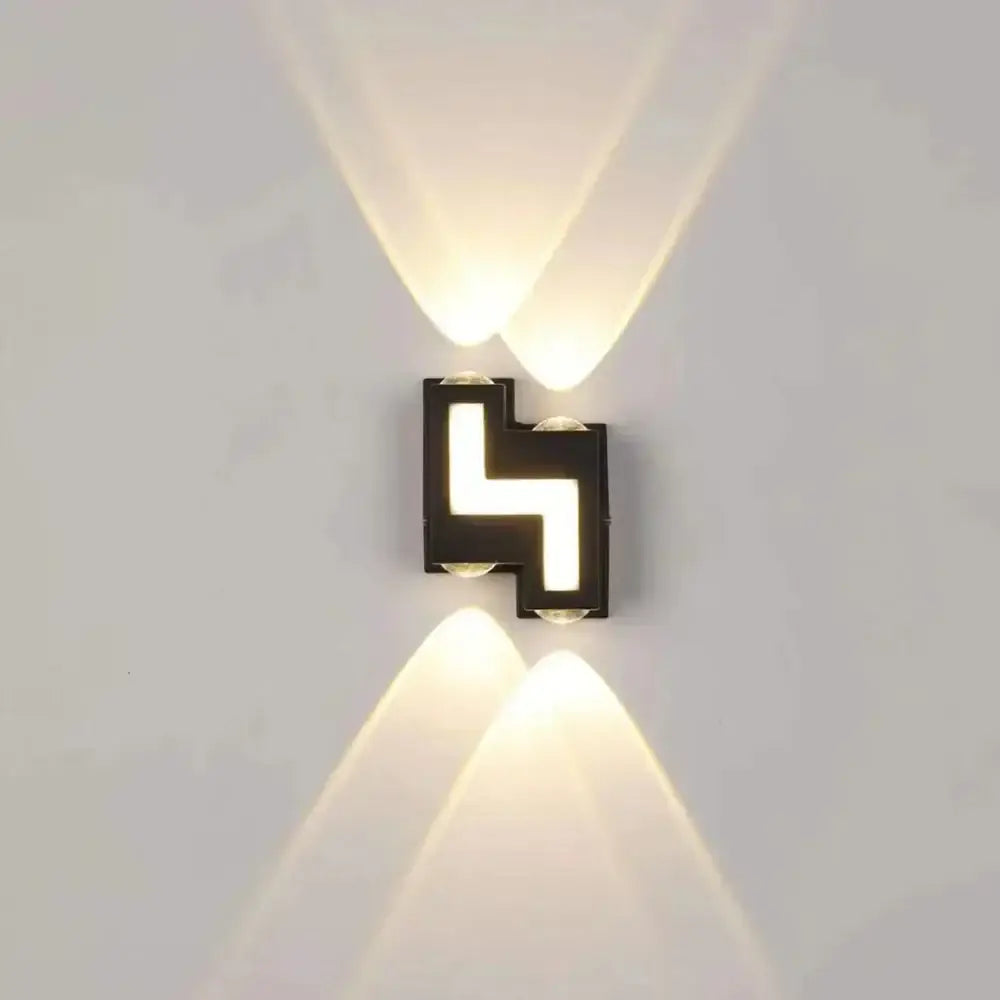Modern black geometric wall lamp with ip65 led lights casting warm beams ideal for decorbites garden waterproof sconce