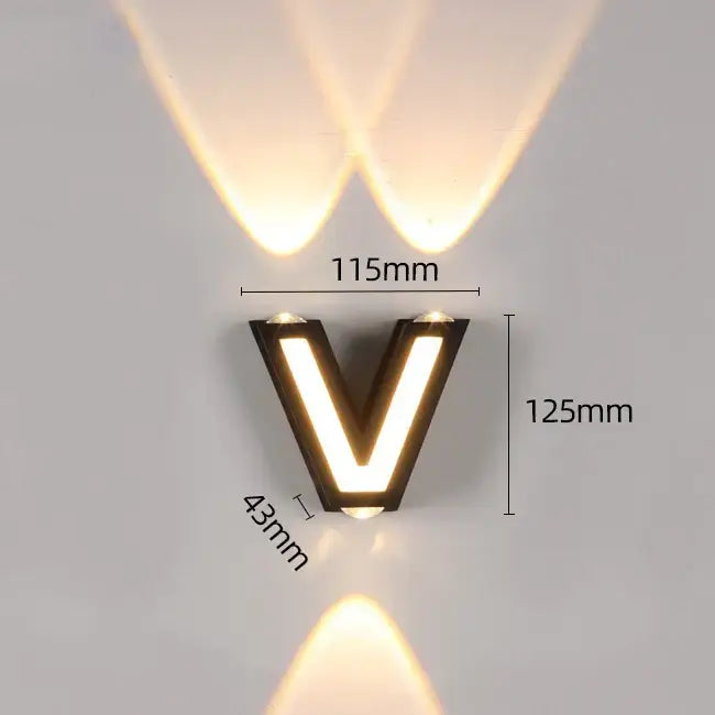 Modern black v-shaped wall lamp decorbites ip65 led with illuminated edges casting warm focused beams for garden use