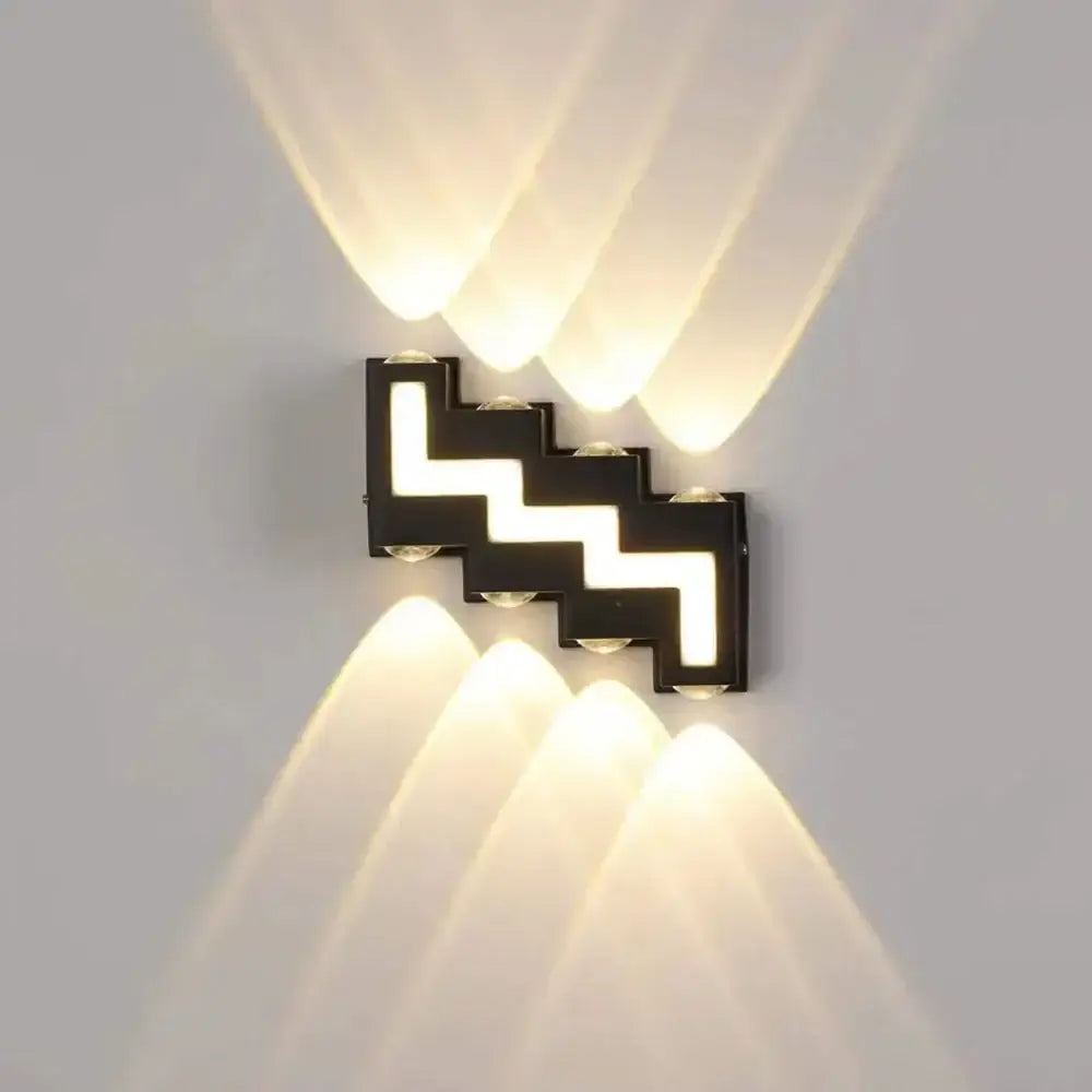 Modern black letter led wall lamp with black zigzag pattern and three warm white beams decorbites ip65 led wall sconce