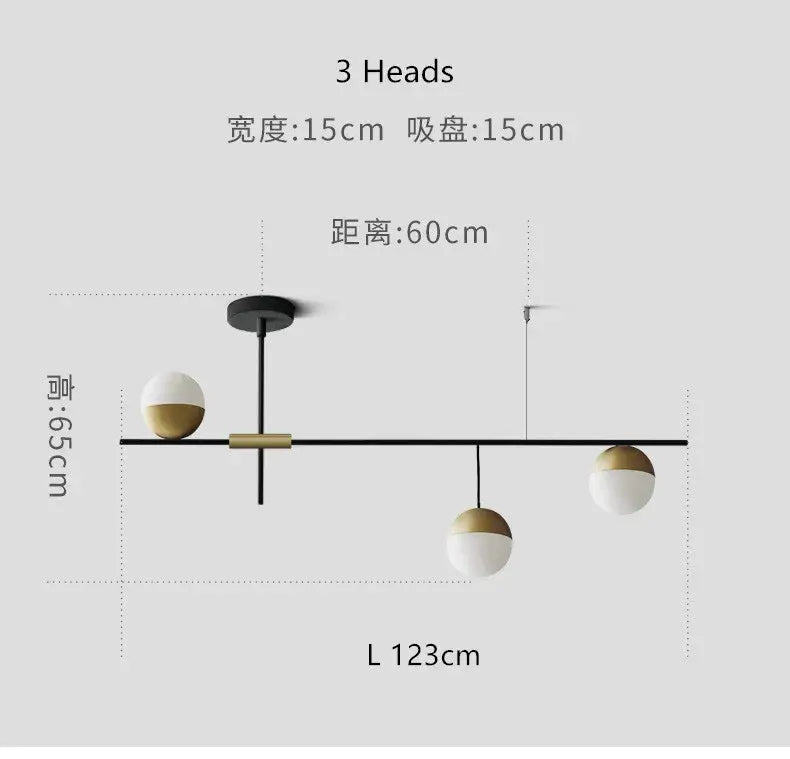 Modern black linear chandelier with glass ball shades featuring three white and gold two-tone spherical bulbs for kitchen decorbites glass ball