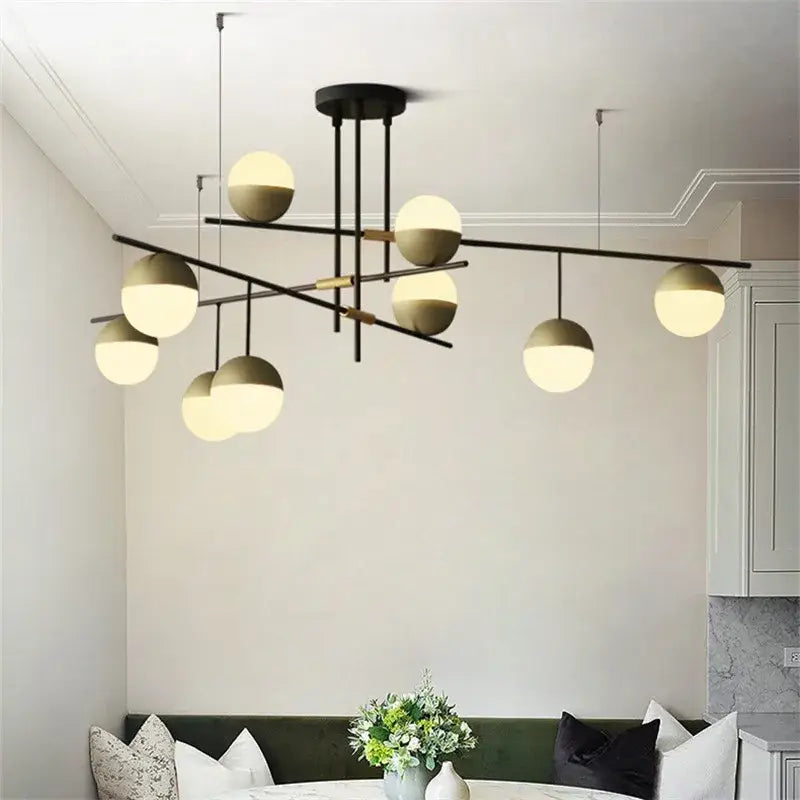 Modern black linear chandelier with frosted glass ball shades for kitchen featuring decorbites glass ball design