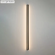 Modern black linear flush mount wall sconce with slim metallic frame and warm ambient glow for hallway lighting