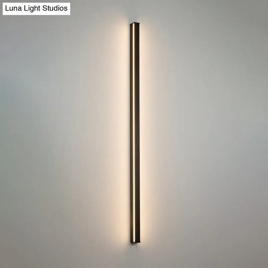 Modern black linear flush mount wall sconce with slim metallic frame and warm ambient glow for hallway lighting
