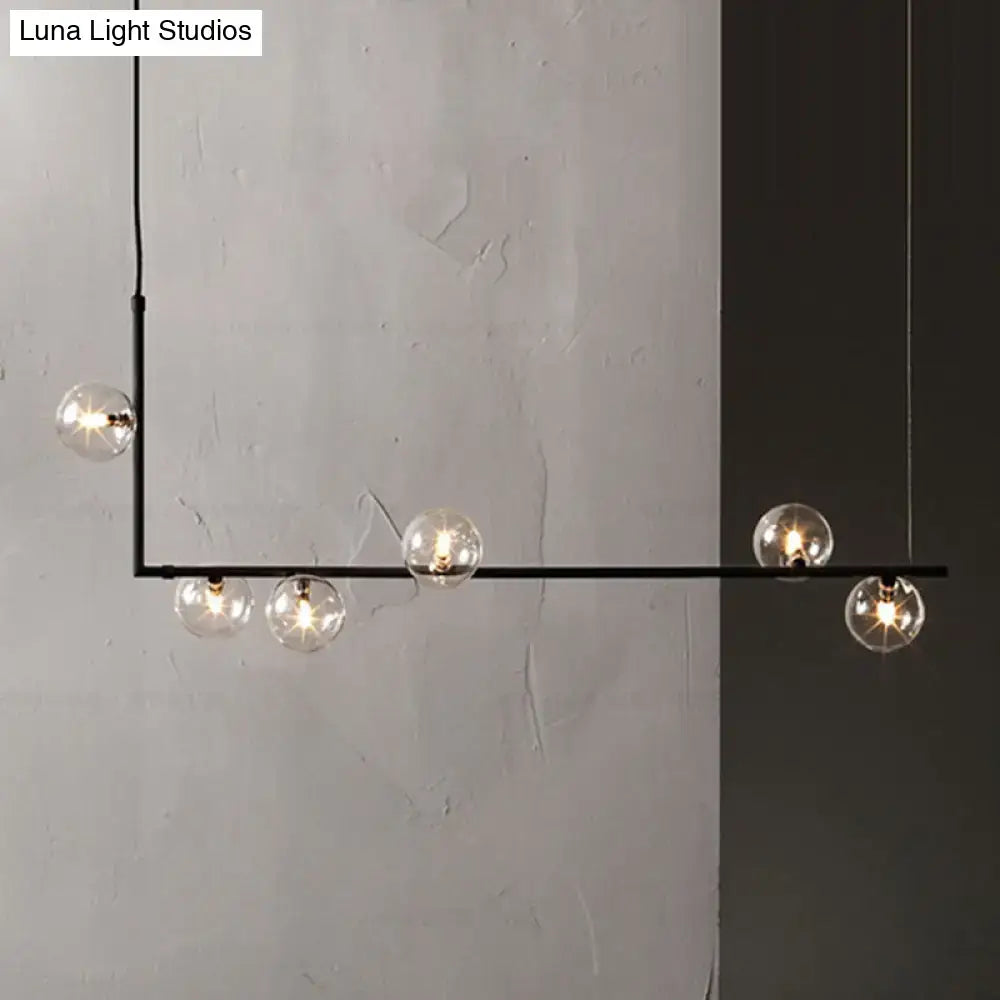 Modern black linear island pendant chandelier with five clear glass shade globes for dining room lighting